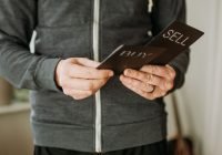 a person holding a cell phone in their hands