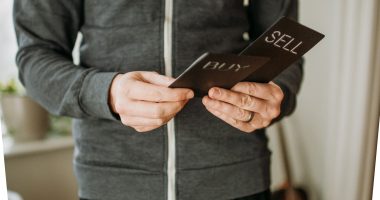 a person holding a cell phone in their hands