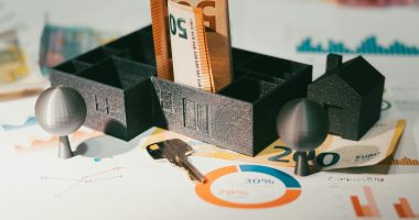 A couple of keys are sitting in a holder